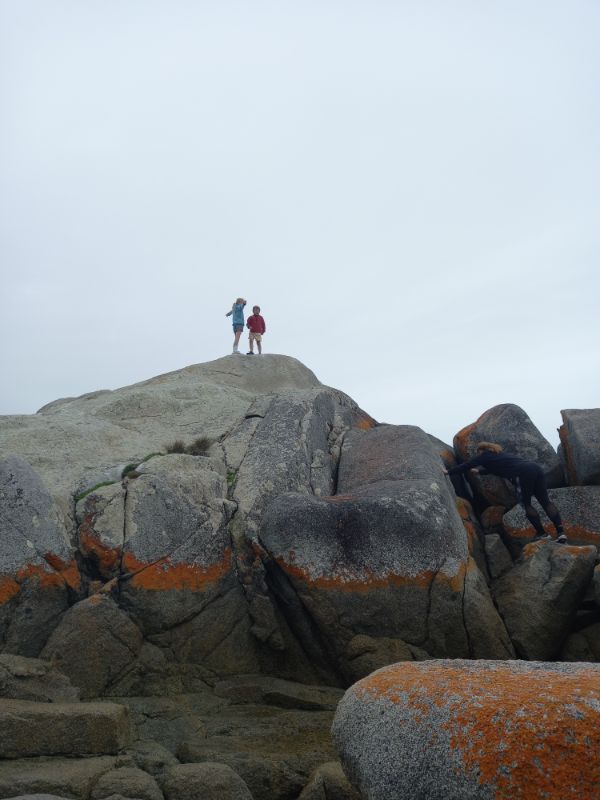 Climbing on the rocks, Bay of Fires